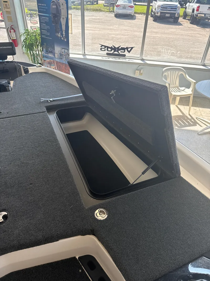 Slide: The Image of Open storage compartment on 2025 Skeeter ZXR20SE boat in showroom. - 21