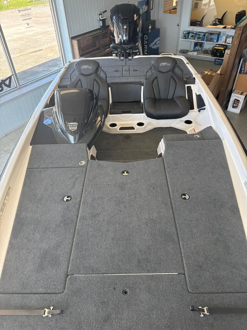 Slide: The Image of 2025 Skeeter ZXR20SE boat interior with seating and storage compartments. - 30
