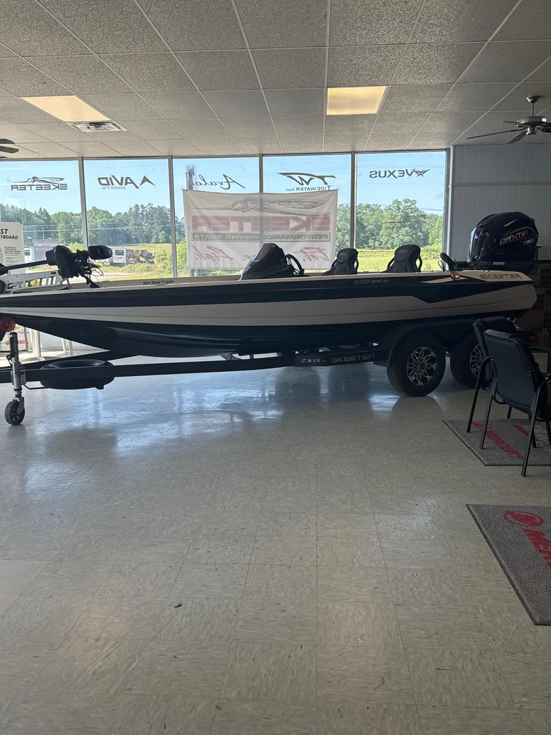 Slide: The Image of 2025 Skeeter ZXR20SE boat displayed indoors on a trailer. - 31