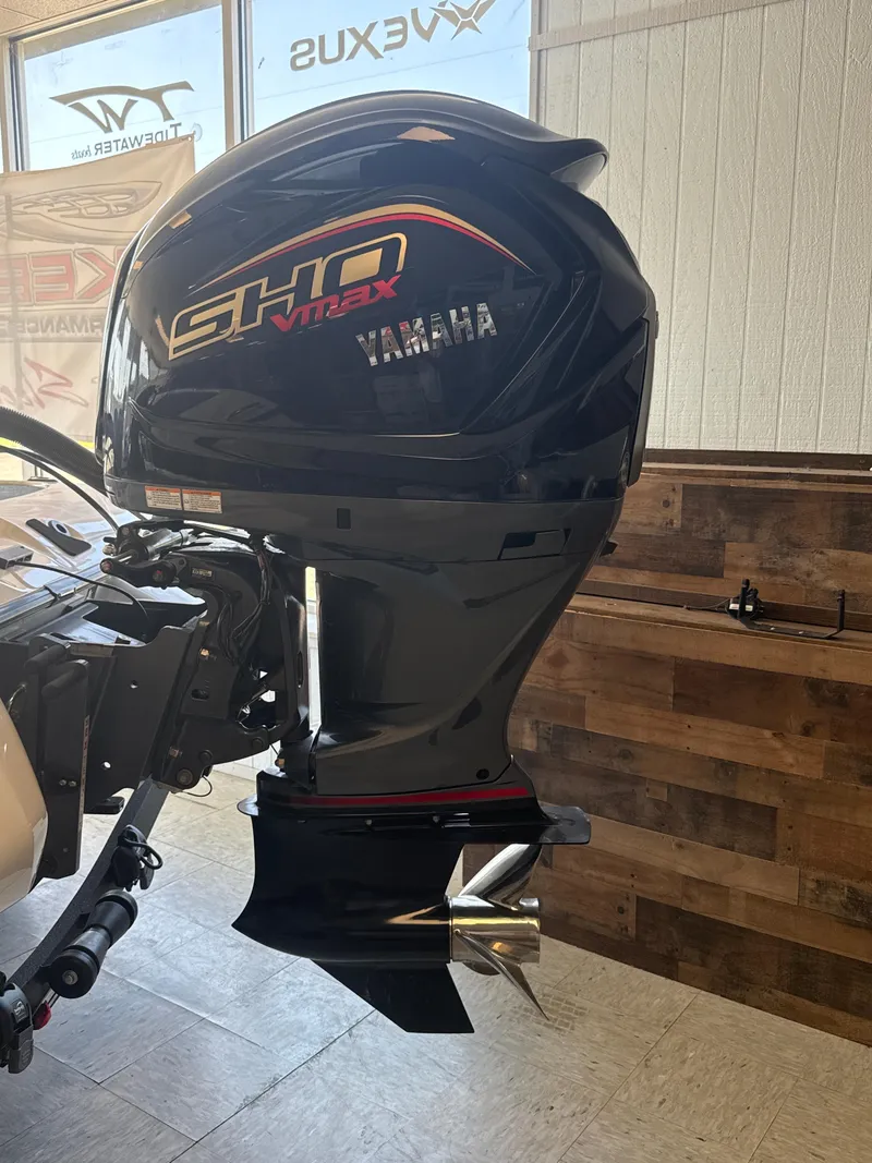 Slide: The Image of Yamaha outboard motor on a 2025 Skeeter ZXR20SE boat, displayed indoors. - 9