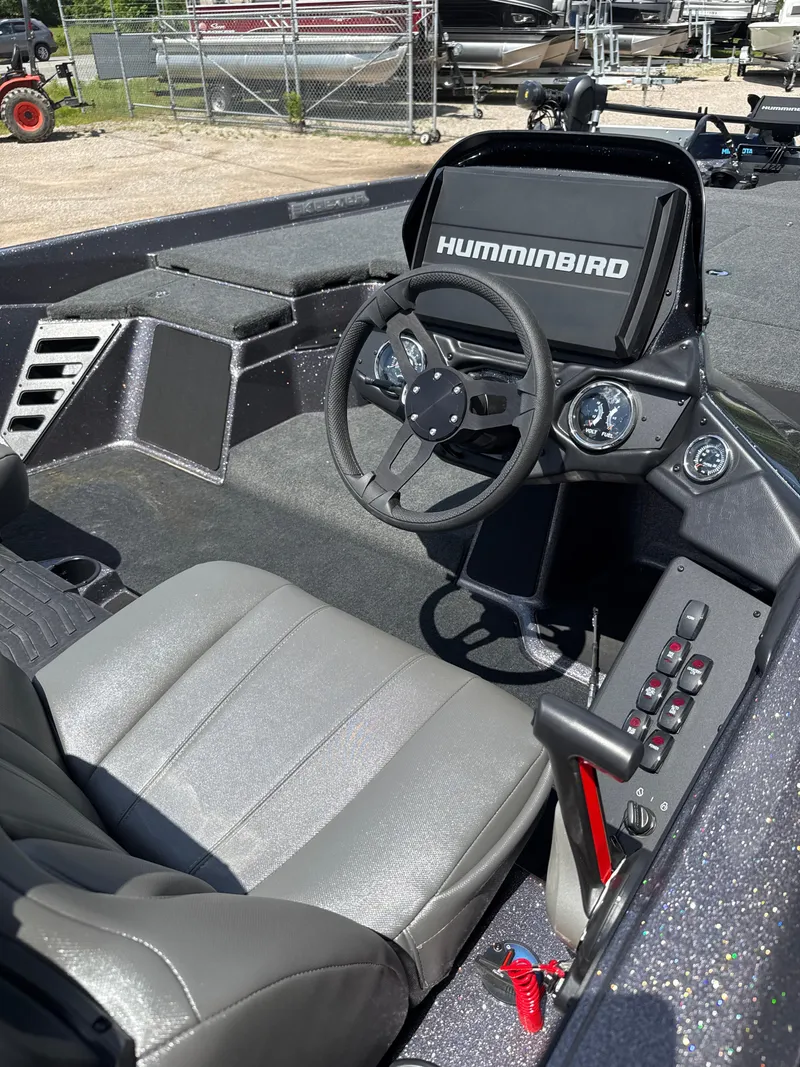 Slide: The Image of 2025 Skeeter ZXR21SE boat cockpit with Humminbird display and steering wheel. - 12