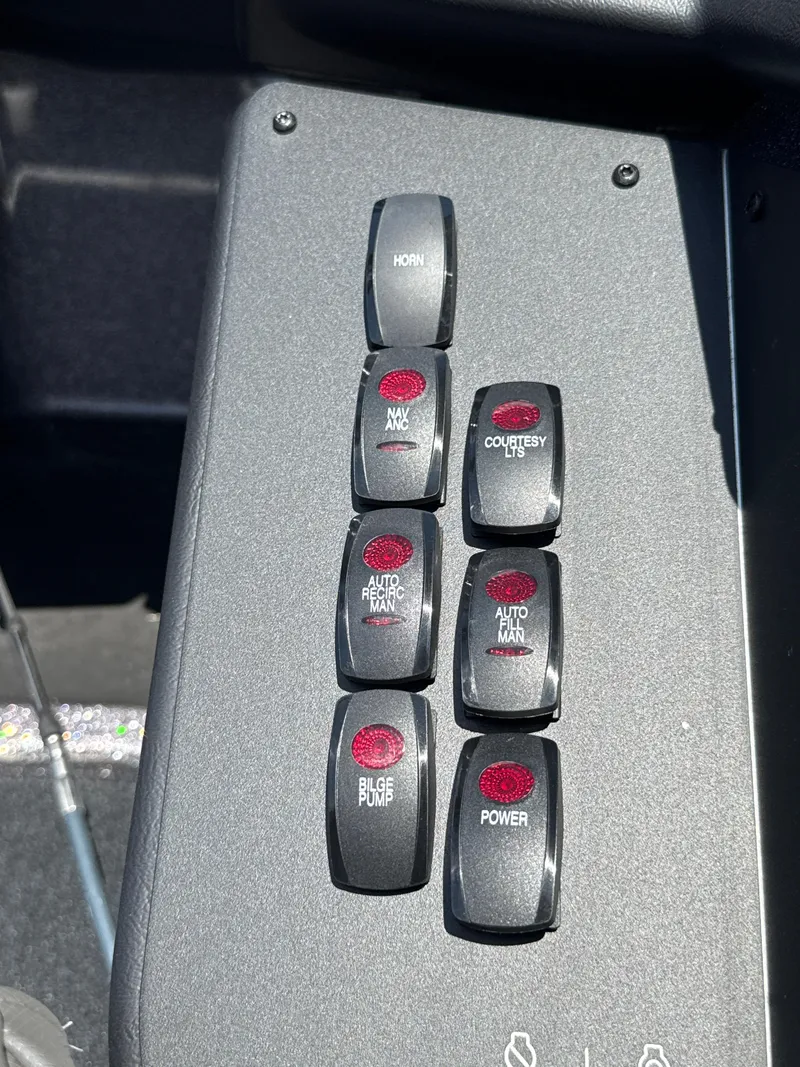 Slide: The Image of Control panel of 2025 Skeeter ZXR21SE boat with labeled switches. - 13
