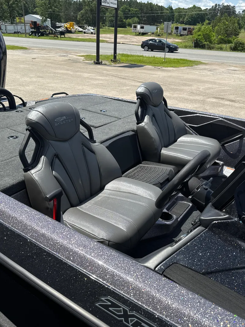 Slide: The Image of 2025 Skeeter ZXR21SE boat interior with sleek gray seats and modern design. - 15