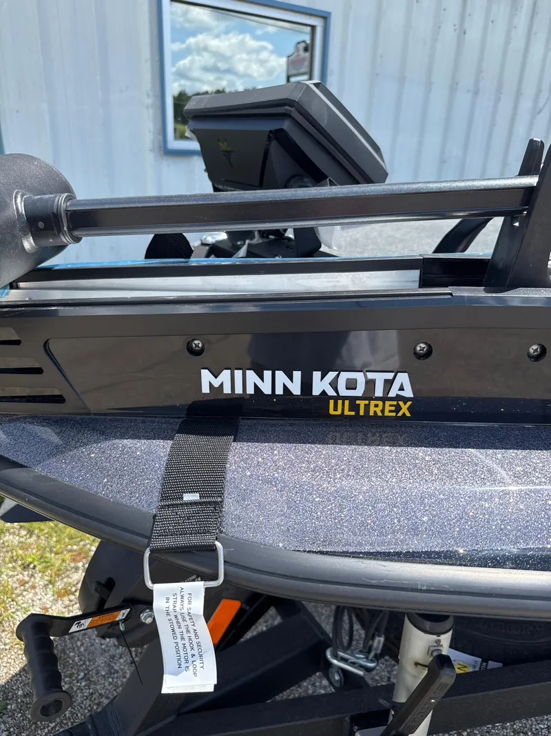 Slide: The Image of Minn Kota Ultrex trolling motor on 2025 Skeeter ZXR21SE boat, outdoor setting. - 19