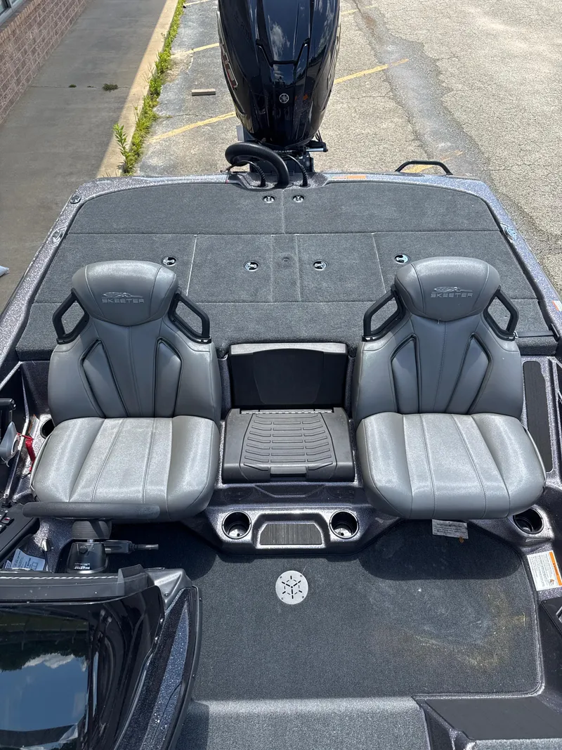 Slide: The Image of 2025 Skeeter ZXR21SE boat interior with dual gray seats and sleek design. - 24