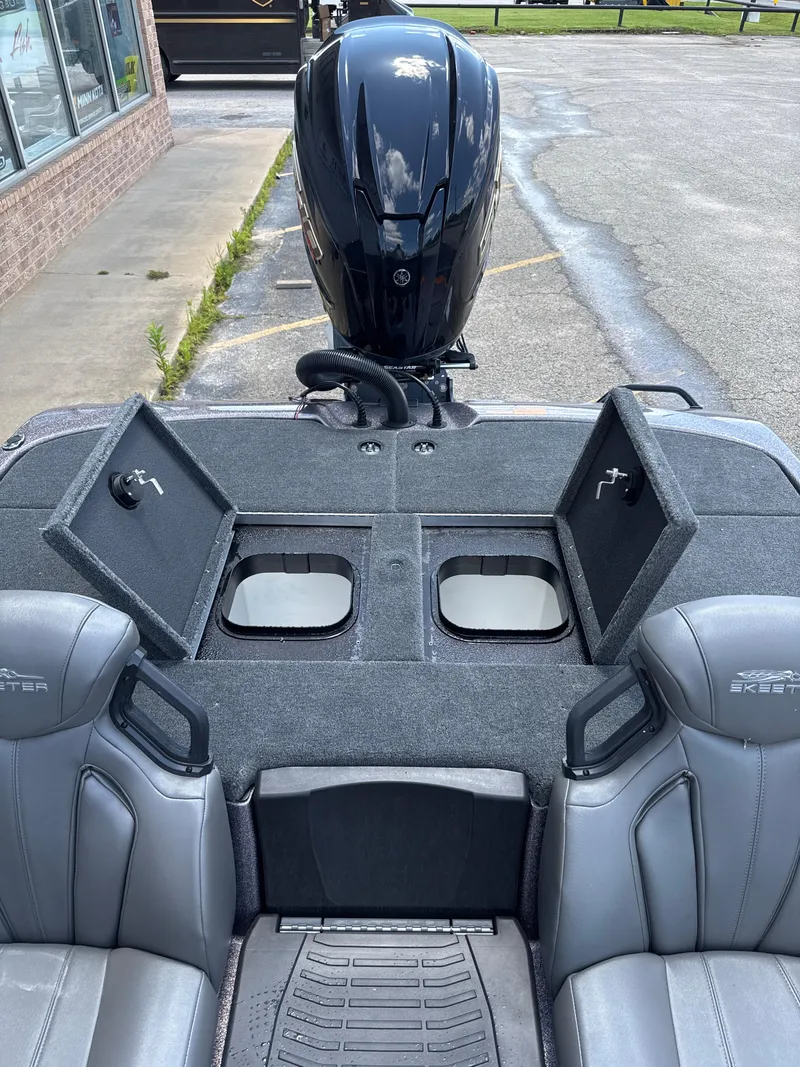Slide: The Image of 2025 Skeeter ZXR21SE boat interior with open storage compartments and seating. - 27