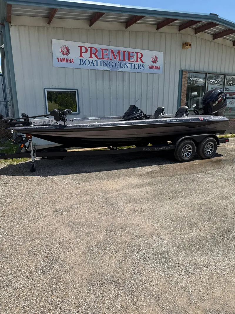 Slide: The Image of 2025 Skeeter ZXR21SE boat at Premier Boating Centers, parked on a trailer. - 29