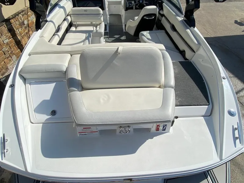 Slide: The Image of 2018 Cobalt CS23 Surf boat interior with white seating and spacious layout. - 10