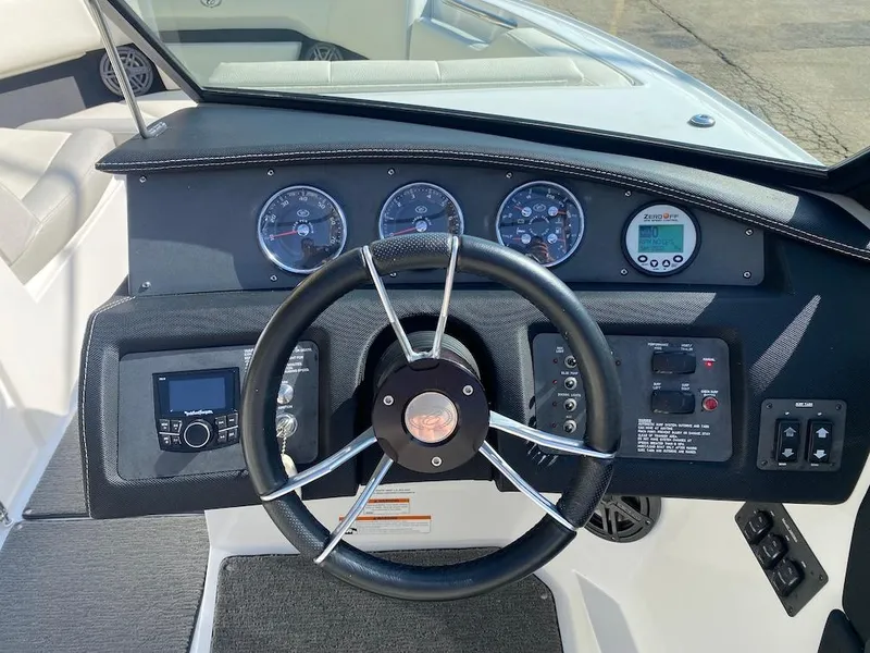 Slide: The Image of 2018 Cobalt CS23 Surf boat dashboard with steering wheel and instrument panel. - 15
