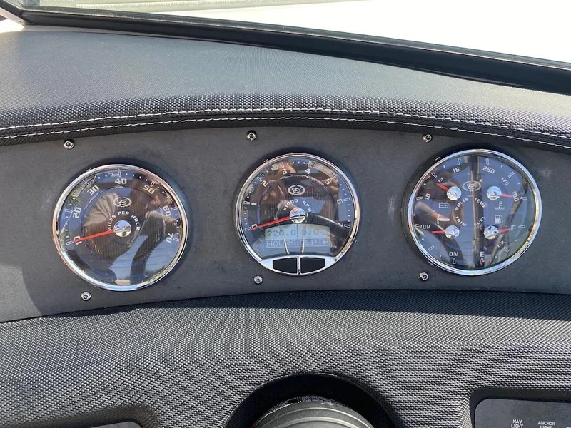 Slide: The Image of Dashboard of a 2018 Cobalt CS23 Surf boat with three circular gauges. - 19