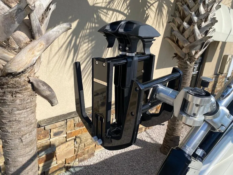 Slide: The Image of 2018 Cobalt CS23 Surf boat accessory mounted near palm trees. - 20