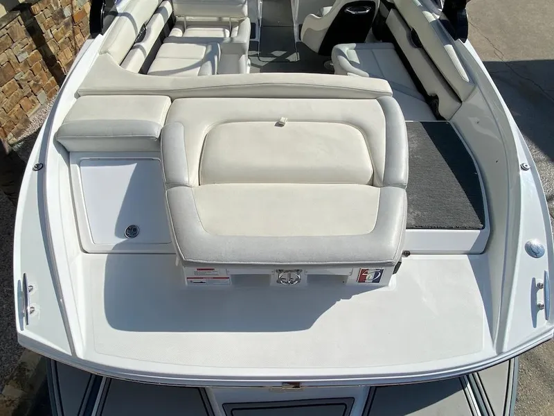 Slide: The Image of 2018 Cobalt CS23 Surf boat with spacious white seating and sleek design. - 9