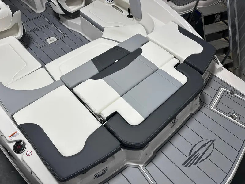 Slide: The Image of 2025 Chaparral 23 SSi boat interior with sleek, modern seating and stylish design. - 6