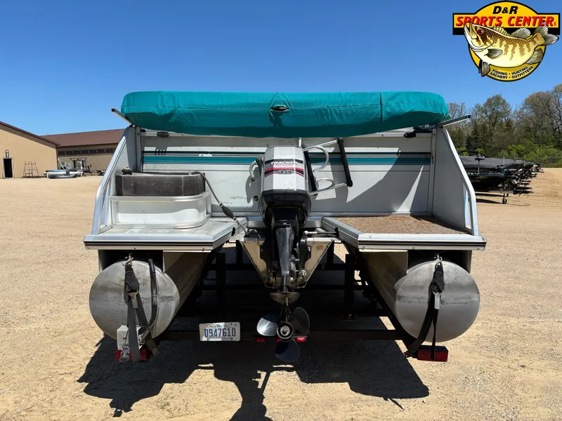 Slide: The Image of 1997 Sun Tracker BASS BUGGY 18 CC pontoon boat with teal canopy and outboard motor. - 3