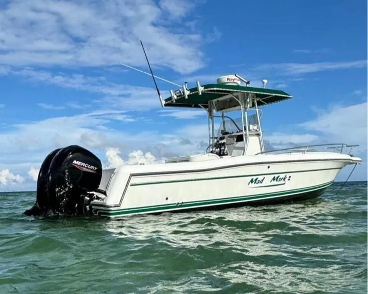 The Image of 2000 Stamas 250 Tarpon boat on water, clear sky, Mercury engine visible. - 0