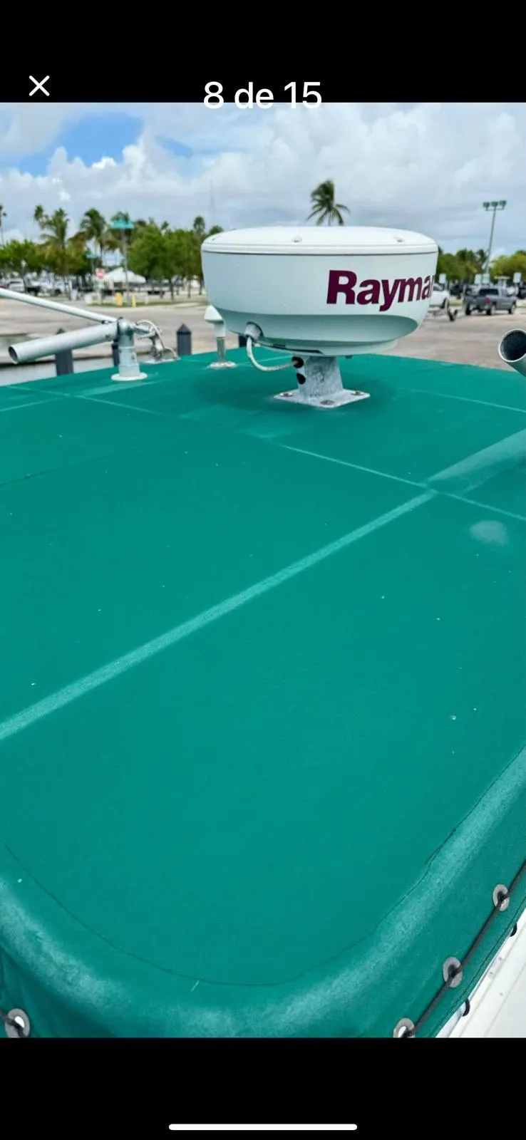 Slide: The Image of Stamas 250 Tarpon 2000 boat with green cover and Raymarine radar on deck. - 5