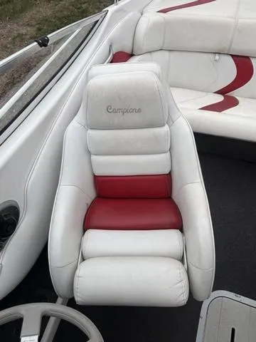 Slide: The Image of 2002 Ebbtide 210 Campione boat seat with white and red upholstery. - 11