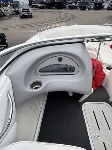 Slide: The Image of 2002 Ebbtide 210 Campione boat interior with seating and storage compartments. - 12