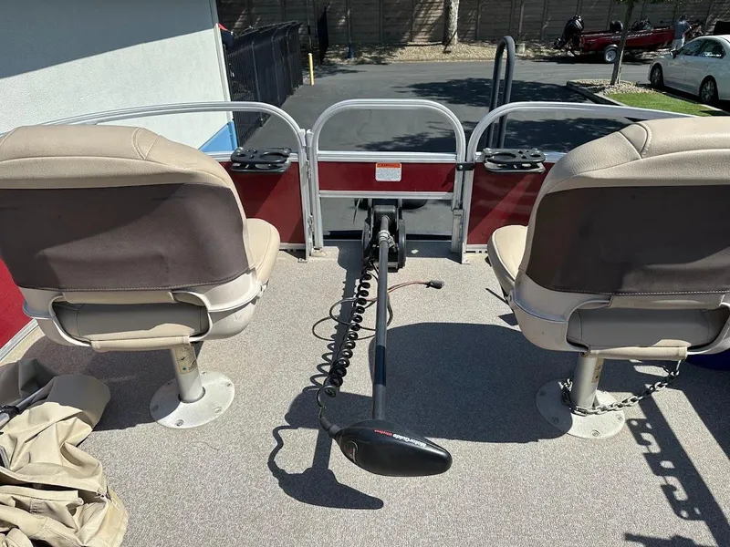 Slide: The Image of 2019 Sun Tracker Bass Buggy 18 DLX pontoon boat with dual seats and trolling motor. - 12