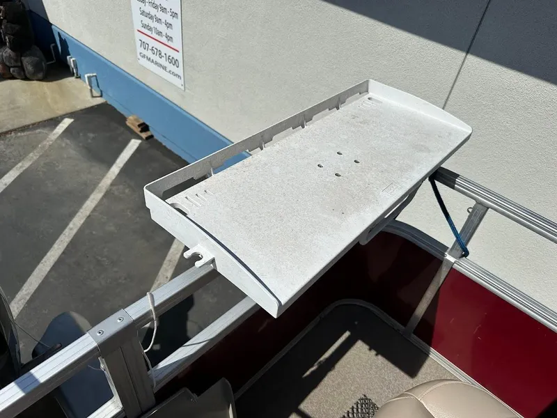 Slide: The Image of 2019 Sun Tracker Bass Buggy 18 DLX boat with a white fishing platform. - 27