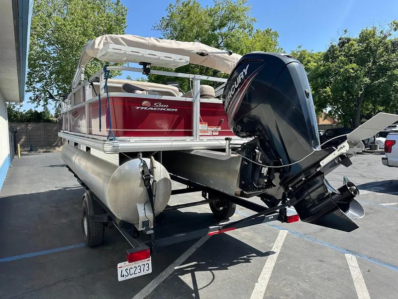 Slide: The Image of 2019 Sun Tracker Bass Buggy 18 DLX pontoon boat with Mercury outboard motor. - 8