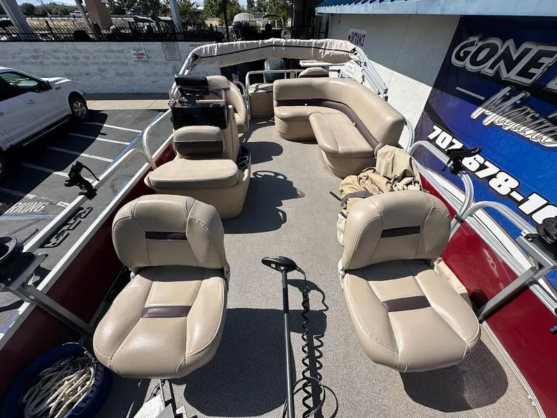Slide: The Image of 2019 Sun Tracker Bass Buggy 18 DLX pontoon boat with beige seating and spacious deck. - 9