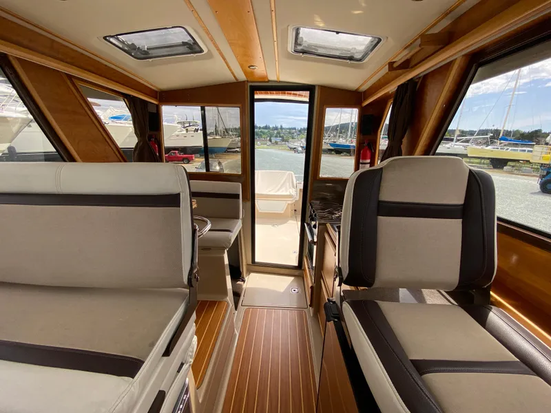 Slide: The Image of Interior of 2017 Cutwater C-28 boat with seating and wood accents. - 20