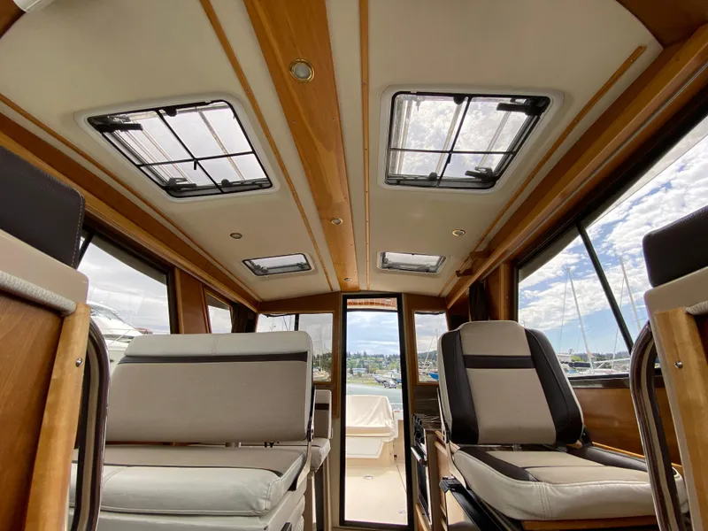 Slide: The Image of Interior of 2017 Cutwater C-28 boat with skylights and seating. - 21