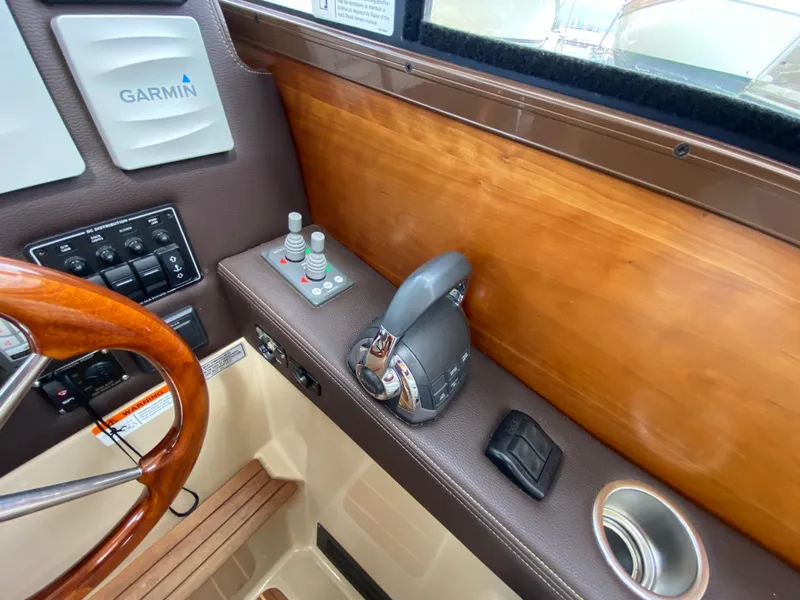 Slide: The Image of 2017 Cutwater C-28 helm with Garmin controls and wooden accents. - 23
