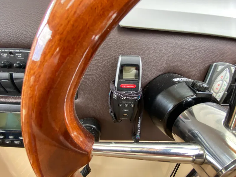 Slide: The Image of Steering wheel and controls of a 2017 Cutwater C-28 boat cockpit. - 27
