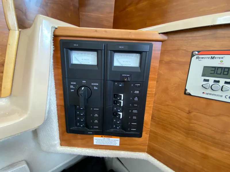 Slide: The Image of Electrical control panel inside a 2017 Cutwater C-28 boat cabin. - 30
