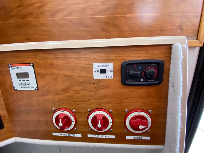 Slide: The Image of Control panel of a 2017 Cutwater C-28 boat with switches and dials. - 33