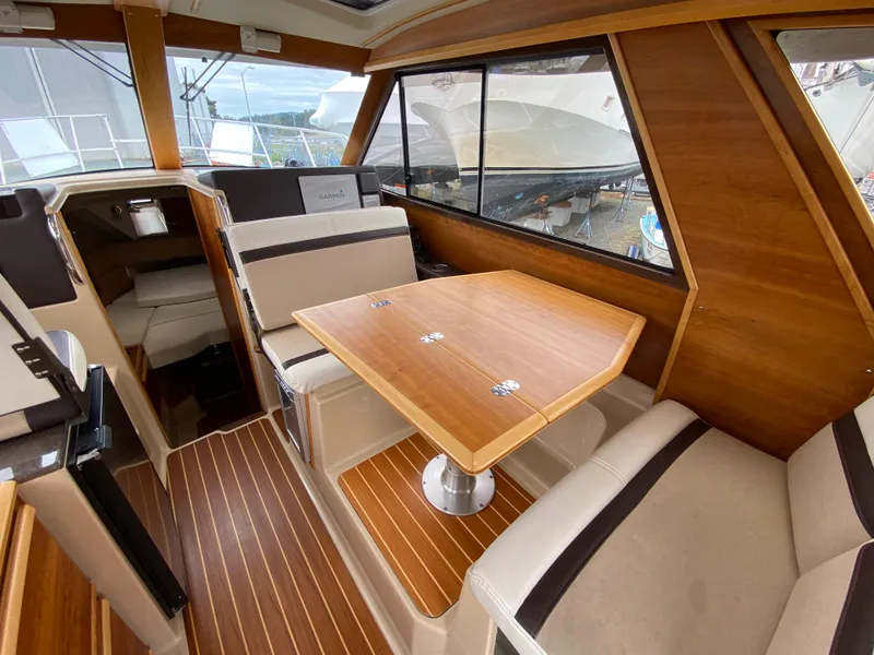 Slide: The Image of 2017 Cutwater C-28 interior with wood accents and seating area. - 4