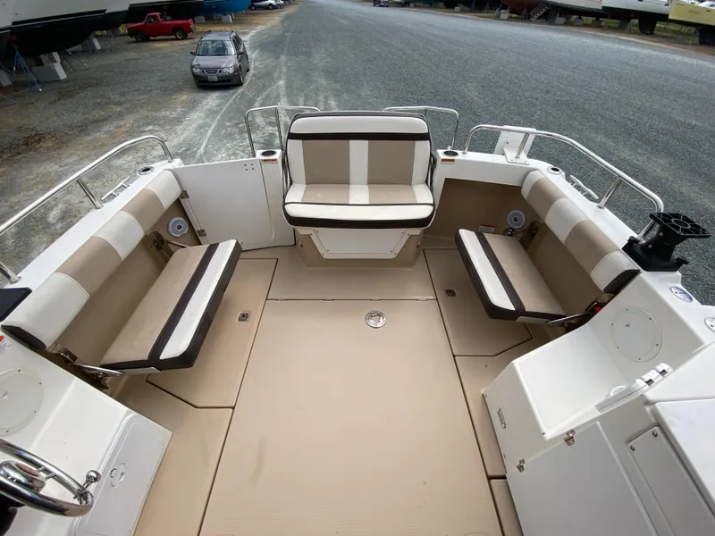 Slide: The Image of 2017 Cutwater C-28 boat interior with beige seating and spacious deck area. - 42