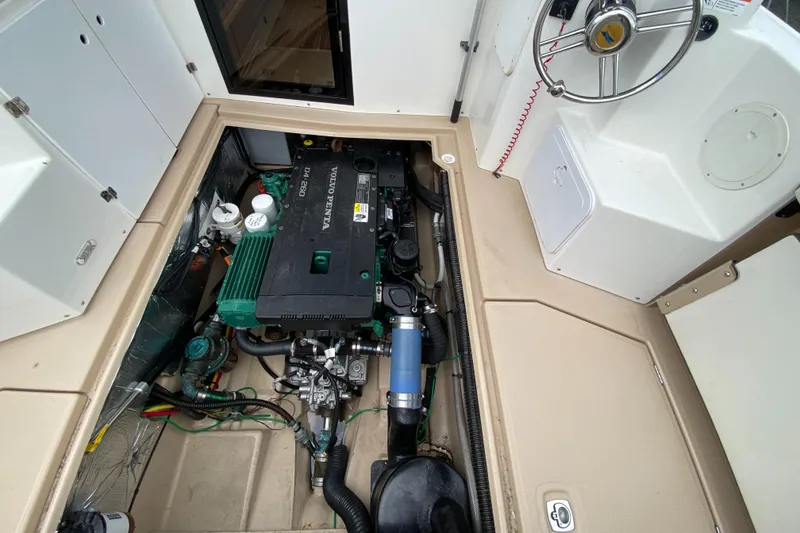 Slide: The Image of Engine compartment of a 2017 Cutwater C-28 boat, showcasing detailed mechanical components. - 43