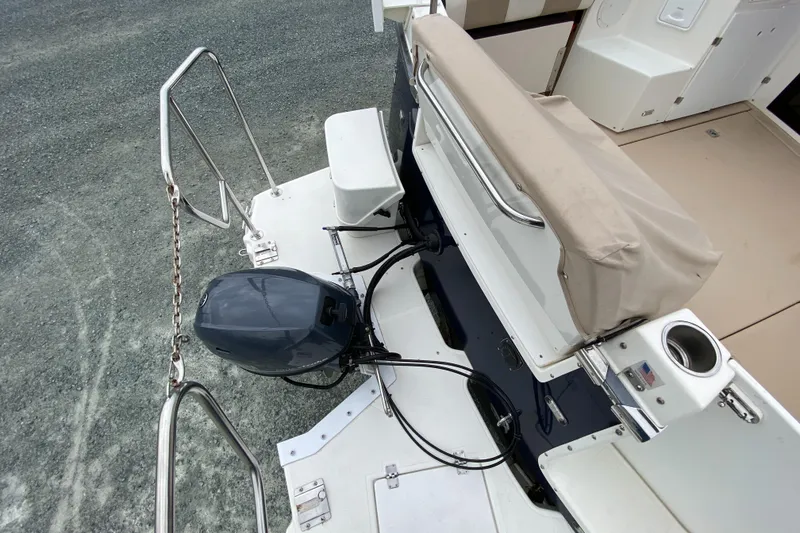 Slide: The Image of 2017 Cutwater C-28 boat stern with outboard motor and seating area. - 46