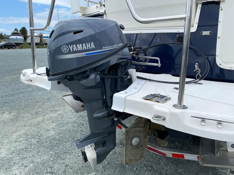 Slide: The Image of 2017 Cutwater C-28 boat with Yamaha outboard motor on a gravel surface. - 48