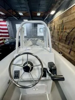 Slide: The Image of 2025 Inmar 430R-AL boat interior with steering wheel and controls in a showroom. - 3