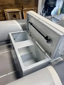 Slide: The Image of 2025 Inmar 430R-AL boat storage compartment with open lid, showcasing interior space. - 6