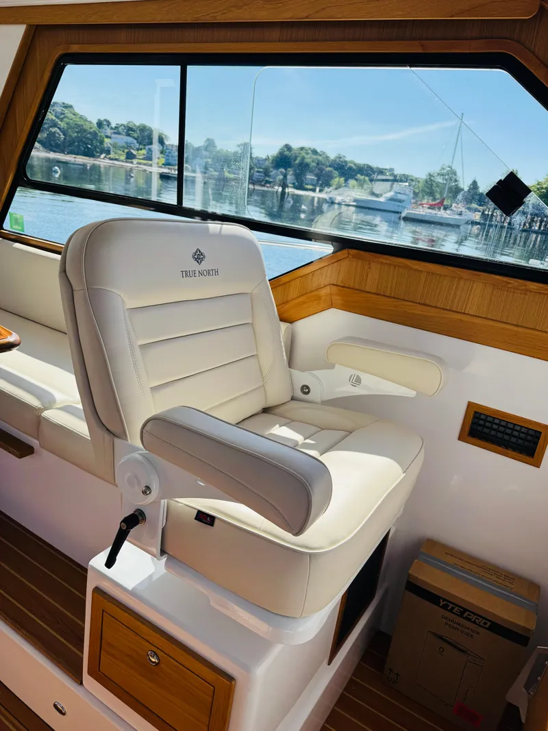 Slide: The Image of Luxurious interior of 2024 True North 34 Outboard Express boat with plush seating. - 26