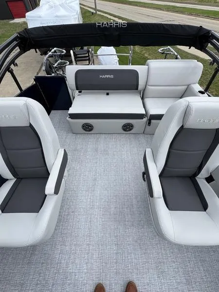 Slide: The Image of 2025 Harris Cruiser 230 boat interior with white and gray seating. - 5