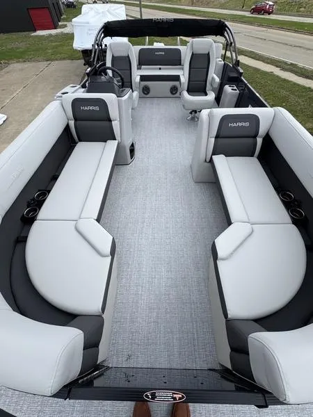 Slide: The Image of 2025 Harris Cruiser 230 pontoon boat with spacious seating and modern design. - 9