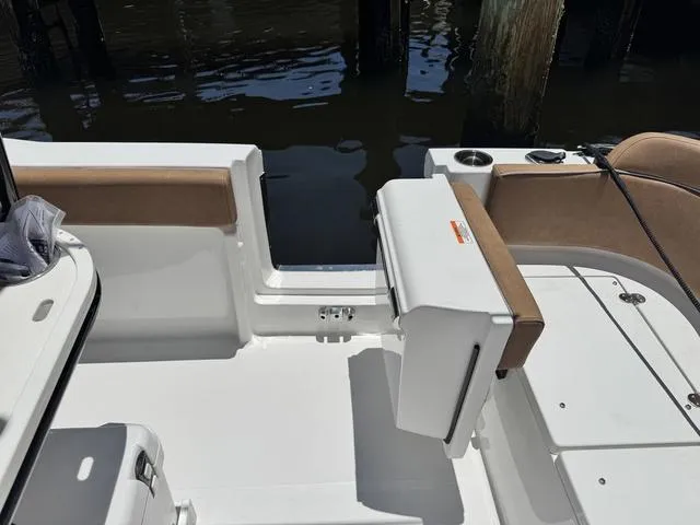 Slide: The Image of 2024 Sea Hunt Ultra 239 SE boat interior with seating and open deck view. - 12