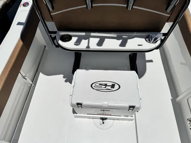 Slide: The Image of 2024 Sea Hunt Ultra 239 SE boat interior with seating and storage. - 14