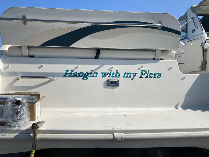 Slide: The Image of 1997 Rinker 266 Fiesta Vee boat with "Hangin with my Piers" text on the stern. - 5