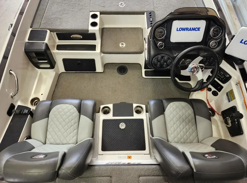 Slide: The Image of 2016 Triton 20 TRX boat interior with Lowrance electronics and dual seating. - 10