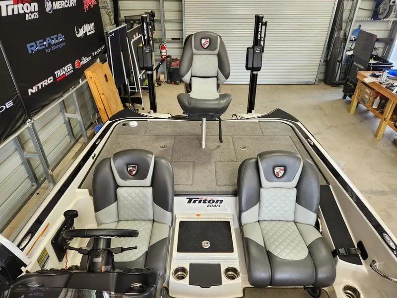 Slide: The Image of 2016 Triton 20 TRX boat interior with gray seating and fishing deck. - 9