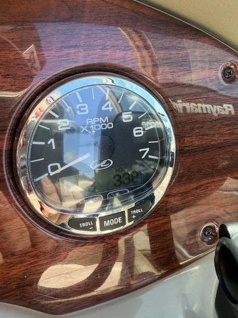Slide: The Image of Tachometer of 2006 Sea Ray 220 Sundeck showing 330 hours, wood panel background. - 16