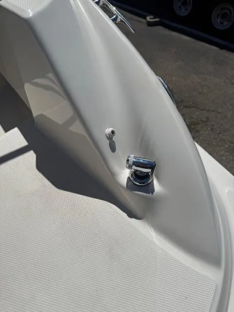 Slide: The Image of 2006 Sea Ray 220 Sundeck boat detail, featuring a chrome cleat on white deck. - 28