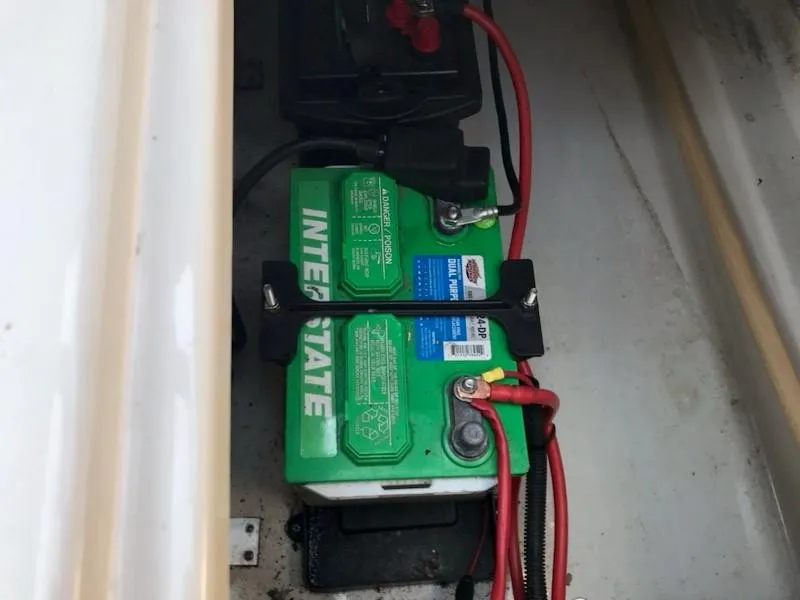 Slide: The Image of Battery compartment of a 2006 Sea Ray 220 Sundeck with Interstate battery. - 32